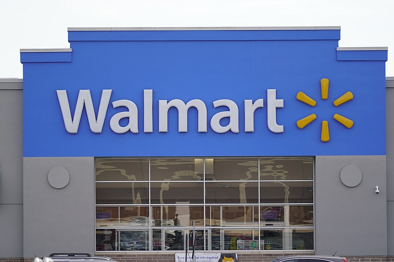 FILE - Shown is a Walmart location in Philadelphia, Wednesday, Nov. 17, 2021.  Walmart is teaming up with a fertility startup to offer benefits under its insurance plan that will help its workers expand their families. The nation’s largest retailer and private employer said Tuesday, Sept. 27, 2022,  it’s partnering with New York-based Kindbody to offer benefits such as in vitro fertilization as well as fertility testing regardless of sex, sexual orientation, gender identity, or marital status.  (AP Photo/Matt Rourke, File)