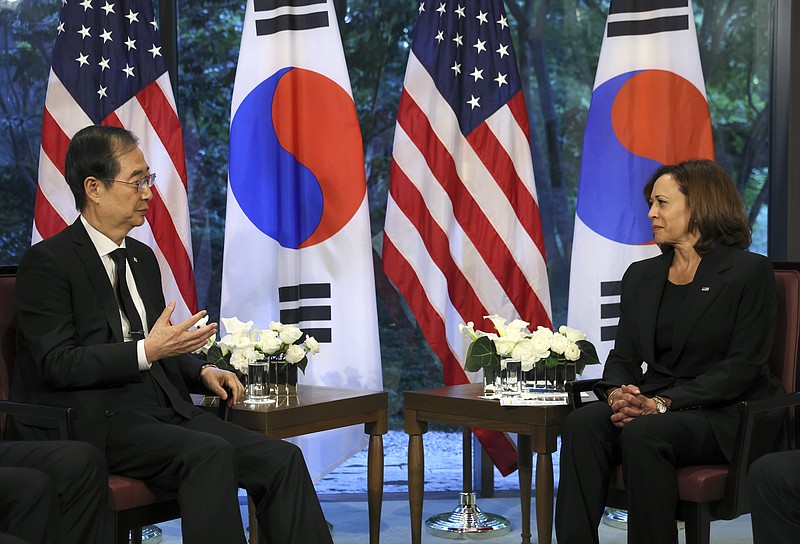 South Korea's Prime Minister Han Duck-soo, left, speaks as U.S. Vice President Kamala Harris listens during a bilateral meeting in Tokyo, Tuesday, Sept. 27, 2022. (Leah Millis/Pool Photo via AP)