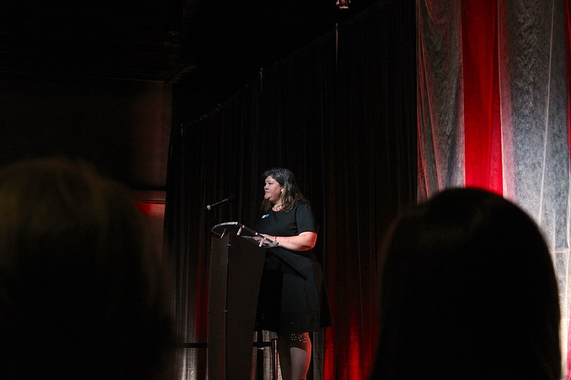 Karen Hicks, Union County coordinator for The CALL, speaks during a fashion and art show fundraiser for the nonprofit held Tuesday evening at the MAD First Financial Music Hall. (Caitlan Butler/News-Times)