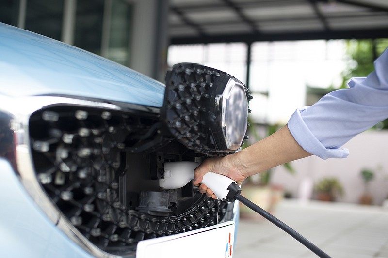 The Inflation Reduction Act contains tax credits and rebates for various home energy efficiency upgrades, including charging stations for electric cars. (Dreamstime/TNS)