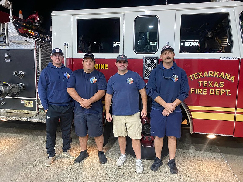 Four Texarkana, Texas, firefighters pose for a photograph early Thursday morning, Sept. 29, 2022, ahead of their deployment to Florida to help with recovery operations after Hurricane Ian. From left are Dakota Johnson, Hayden Moore, Rodney Lathrop and Jonathan Mixon. (Photo provided by Texarkana Texas Fire Department)