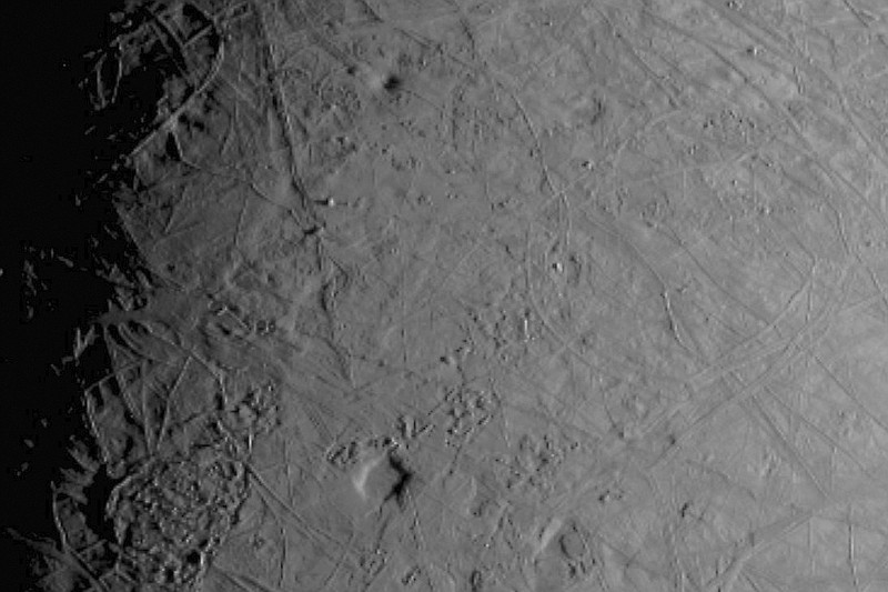 This image made available by NASA shows the complex, ice-covered surface of Jupiter's moon Europa, captured by NASA's Juno spacecraft during a flyby on Thursday, Sept. 29, 2022. At closest approach, the spacecraft came within a distance of about 219 miles. (NASA/JPL-Caltech/SWRI/MSSS via AP)