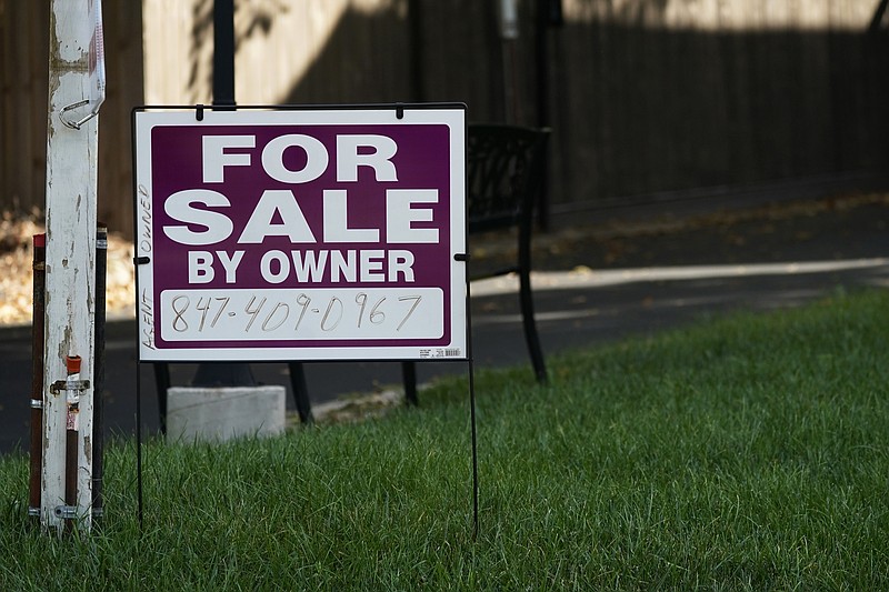 For sale by owner sign is displayed outside home in Northbrook, Ill., Wednesday, Sept. 21, 2022. (AP/Nam Y. Huh)