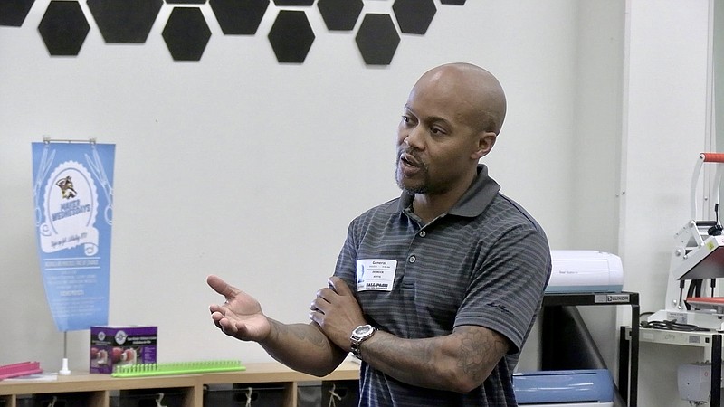 Former professional athletic trainer Derrick Fitts talks to students at Lake Hamilton High School during Friday's Coffee and Careers session. - Photo by Lance Porter of The Sentinel-Record