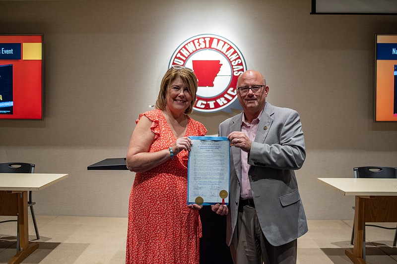 Teara Lindholm and Mayor Bob Bruggeman of Texarkana, Texas, hold a proclamation Thursday, Sept. 29, 2022, designating October as National Disability Employment Awareness Month. Lindholm is the business engagement representative with Arkansas Division of Workforce Services, Arkansas Rehabilitation Services Division. (Staff photo by Erin DeBlanc)