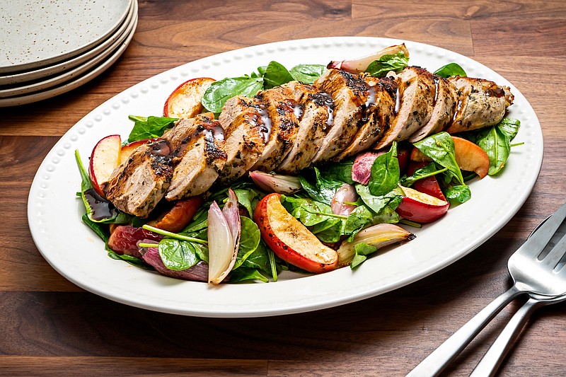 Roasted Pork Tenderloin With Apples, Shallots and Spinach. MUST CREDIT: Photo by Scott Suchman for The Washington Post.