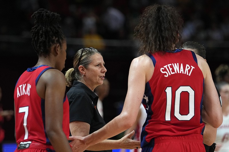 United States' coach Cheryl Reeve, center, talks with her players during their semifinal game against Canada at the women's Basketball World Cup in Sydney, Australia, Friday, Sept. 30, 2022. (AP Photo/Rick Rycroft)