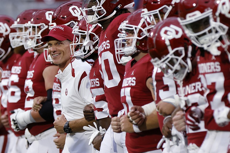 Oklahoma head coach Brent Venables walks on the field with his team before an NCAA college football game against Kansas State, Saturday, Sept. 24, 2022, in Norman, Okla. (AP Photo/Nate Billings)