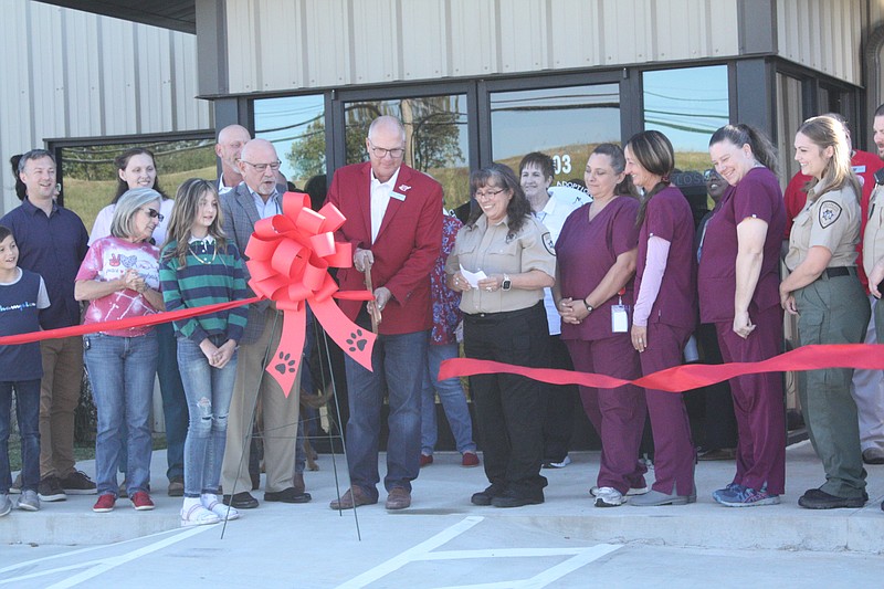 Mayor Allen Brown cuts the ribbon during the grand opening of the Animal Care and Adoption Center Friday, Sept. 30, 2022, at 203 Harrison St. in Texarkana, Ark. (Staff photo by Mallory Wyatt)