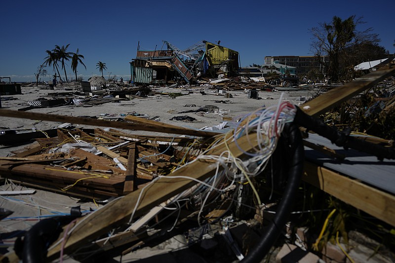 Businesses near the beach lie in ruins as others were completely swept away, two days after the passage of Hurricane Ian, in Fort Myers Beach, Fla., Friday, Sept. 30, 2022. (AP Photo/Rebecca Blackwell)