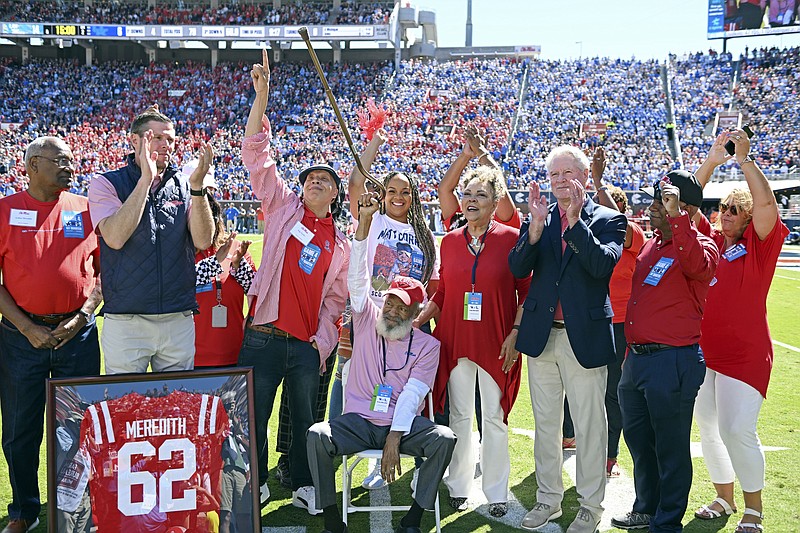 James Meredith, who in 1962 became the first Black student to enroll at the University of Mississippi, is honored during the first half of an NCAA college football game between Mississippi and Kentucky in Oxford, Miss., Saturday, Oct. 1, 2022. The university is holding several events this academic year to mark 60 years of integration and to honor Meredith's legacy. (AP Photo/Thomas Graning)