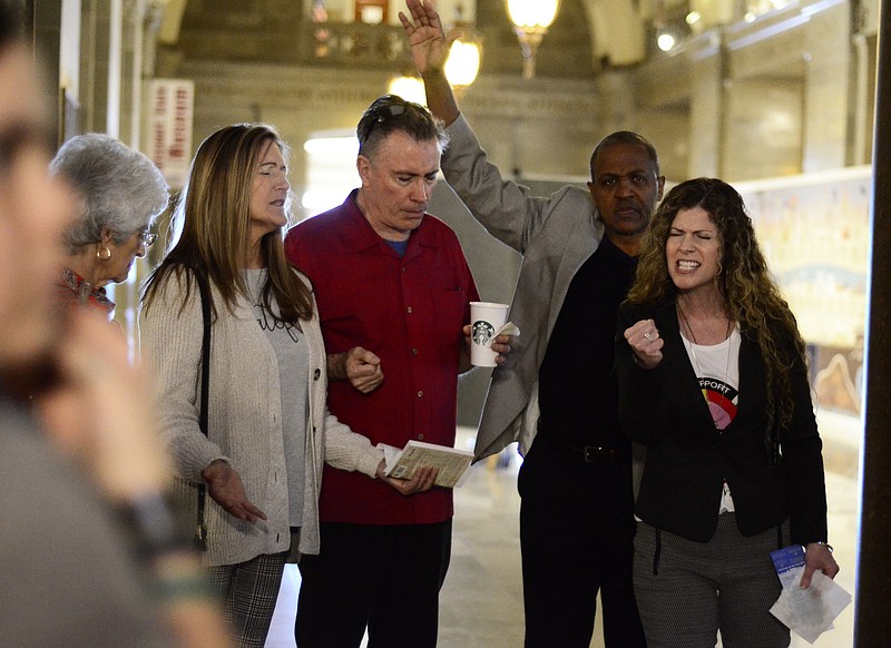 Eileen Wisniowicz/News Tribune photo: 
Cindy Hatcher, right, and her husband Howard Hatcher, founder of Color Free America, lead a prayer in the Missouri State Capitol in Saturday, Oct. 1, 2022. The Hatchers later went through the Capitol with others preaching and singing.