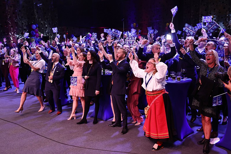 FILE - Supporters of the Sweden Democrats react on the results of the exit polls at the party's election watch at the Elite Hotel Marina Tower in Nacka, near Stockholm, Sweden, Sunday, Sept. 11, 2022. A right-wing populist party that received the second-most votes in Sweden’s general election last month landed the chairmanships of four parliamentary committees Saturday Oct. 1, 2022, and with it, the ability to wield more influence in mainstream Swedish politics. The positions to be held by lawmakers from the Sweden Democrats include chairing the Riksdag's justice, foreign affair, business affairs and labor market committees. (Stefan Jerrevång/TT News Agency via AP, File)