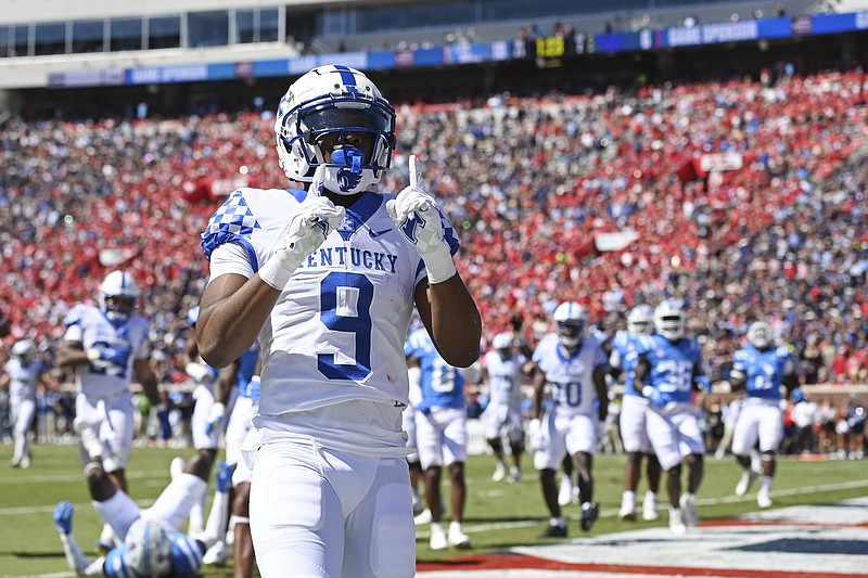 Kentucky wide receiver Tayvion Robinson (9) reacts after a 5-yard touchdown catch during the first half of an NCAA college football game against Mississippi in Oxford, Miss., Saturday, Oct. 1, 2022. (AP Photo/Thomas Graning)