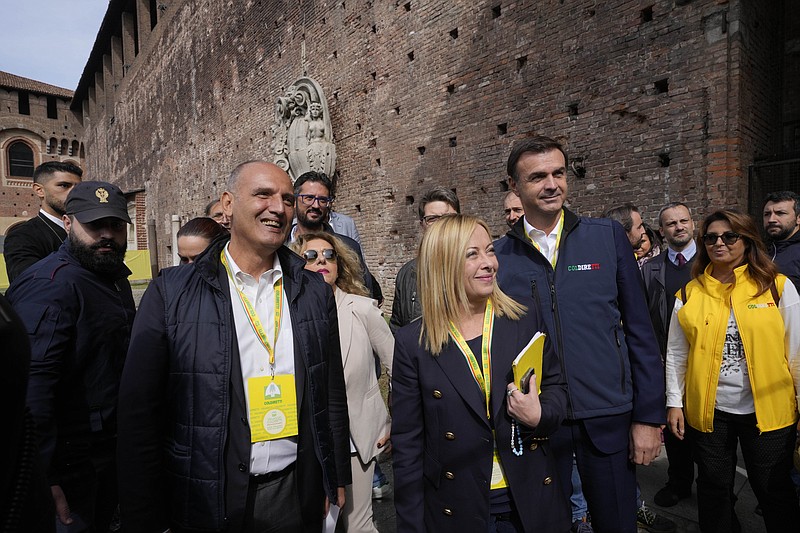 Brothers of Italy leader Giorgia Meloni arrives at the Sforzesco Castle to attend Italian farmers association's event, in Milan, Italy, Saturday, Oct. 1, 2022. (AP Photo/Luca Bruno)