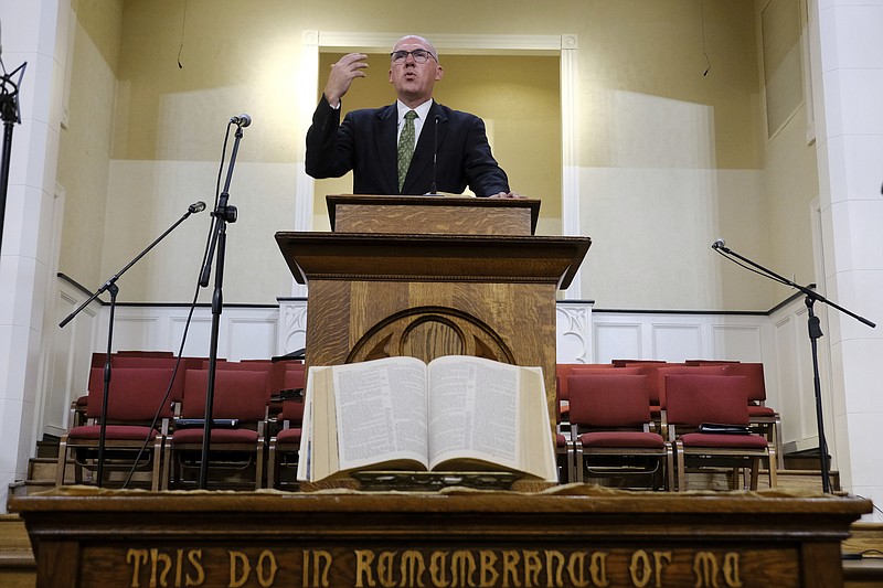 Pastor Bart Barber, president of the Southern Baptist Convention, preaches from the pulpit Sunday, Sept. 25, 2022, at First Baptist Church of Farmersville, Texas. For nearly a quarter-century, Barber enjoyed relative obscurity as a pastor in this town of 3,600, about 50 miles northeast of Dallas. That changed in June as delegates to the Southern Baptist Convention’s annual meeting in California chose Barber to lead the nation’s largest Protestant denomination at a time of major crisis. (AP Photo/Audrey Jackson)
