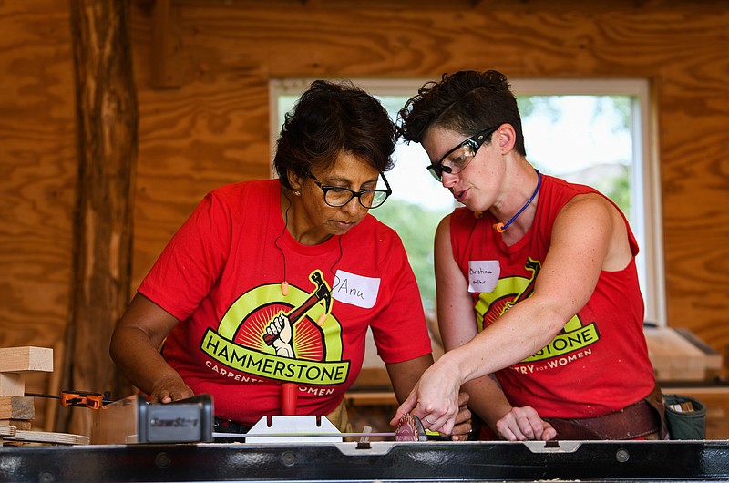 Anu Rangarajan, left, gets help from instructor Christina Alario during a recent class at Hammerstone. (For The Washington Post/Heather Ainsworth)