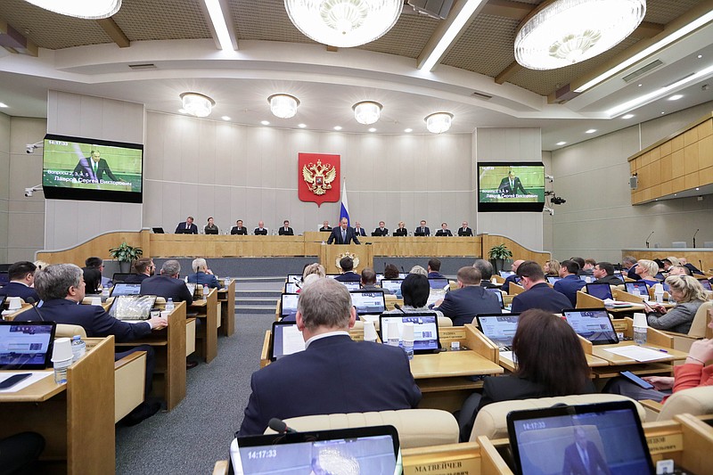 In this handout photo released by The State Duma, The Federal Assembly of The Russian Federation Press Service, Russian Foreign Minister Sergey Lavrov, foreground center, addresses deputies during a session at the State Duma, the Lower House of the Russian Parliament in Moscow, Russia, Monday, Oct. 3, 2022. Russia's lower house of parliament endorses treaties for 4 regions of Ukraine to join Russia. (The State Duma, The Federal Assembly of The Russian Federation Press Service via AP)