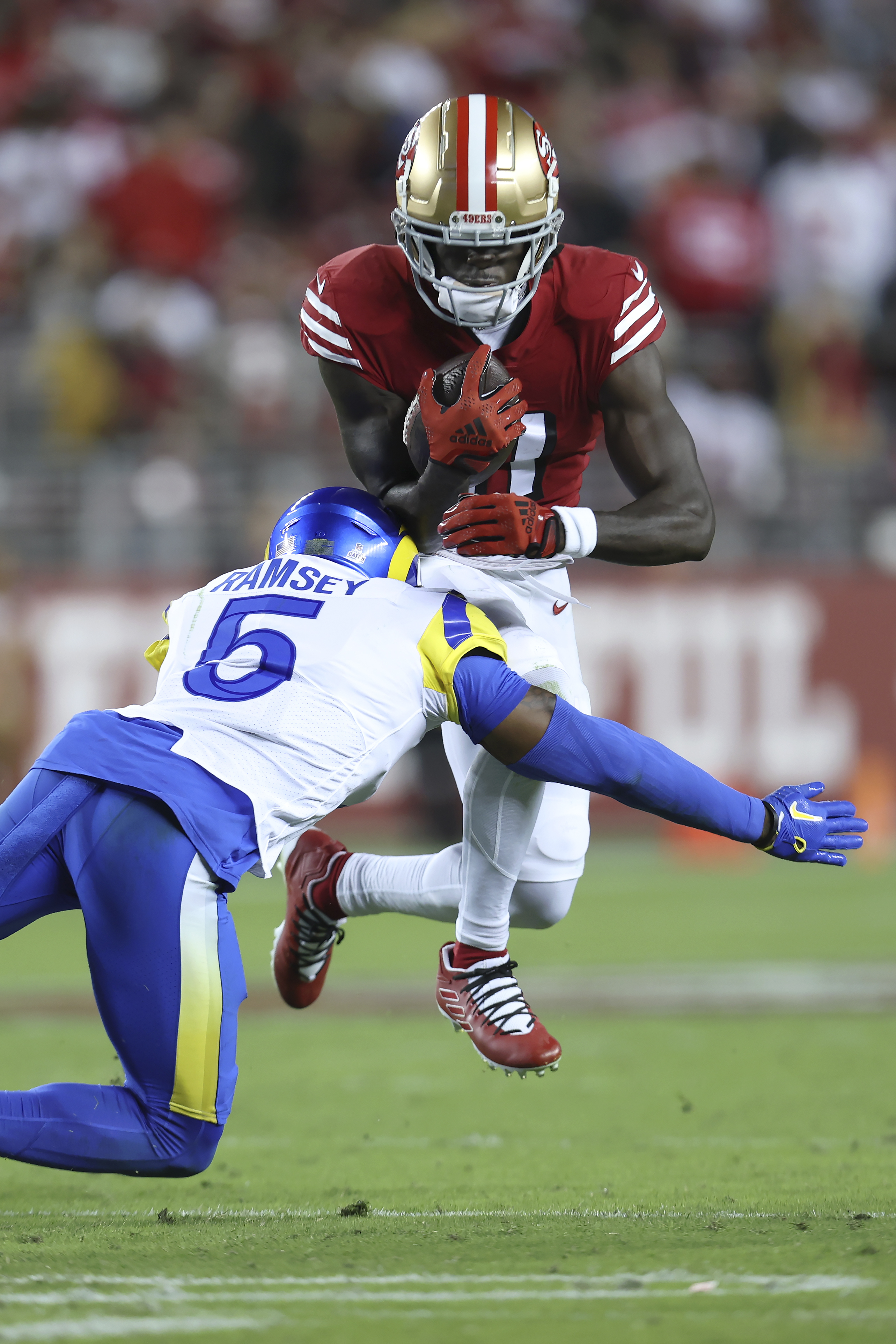 Defensive lineman (97) Nick Bosa of the San Francisco 49ers sacks  quarterback (9) Matthew Stafford of the Los Angeles Rams in an NFL football  game, Monday, Oct. 3, 2022, in Santa Clara