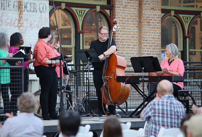 Mary Scott Smith, right, performs with the Texarkana Regional Chorale during an “Al Fresco” concert Monday, Sept. 27, 2021 outside the 1894 City Market in downtown Texarkana, Arkansas. TRC's "Al Fresco" series will continue Friday, Oct. 14, 2022, with the theme "Music of the Night." (Staff file photo by Danielle Dupree)