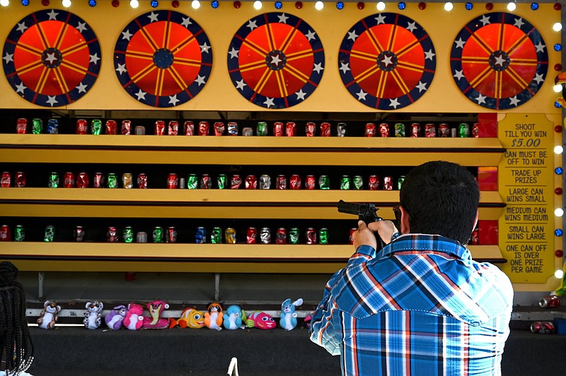 Rides, carnival games, culinary competitions, livestock judging and fair food are all prominent aspects of the Arkansas State Fair. (Democrat-Gazette file photo/Stephen Swofford)