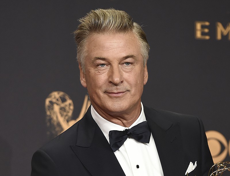 Alec Baldwin poses in the press room with the award for outstanding supporting actor in a comedy series for "Saturday Night Live" at the 69th Primetime Emmy Awards in Los Angeles on Sept. 17, 2017. 
(Photo by Jordan Strauss/Invision/AP, File)