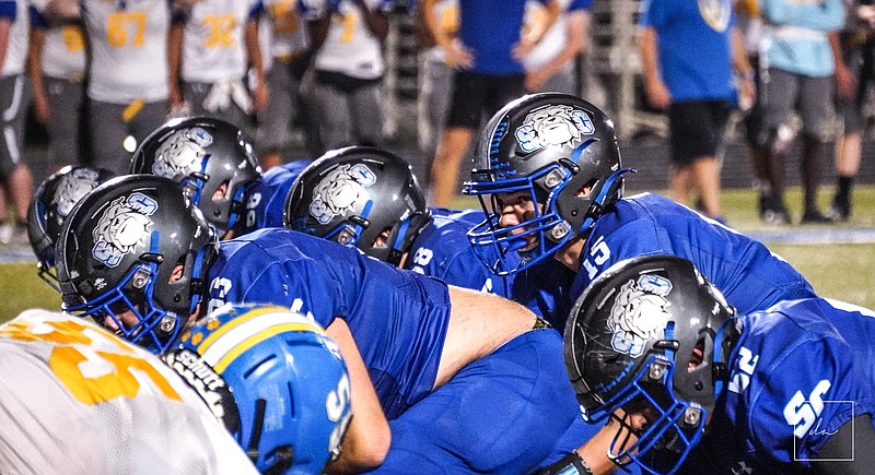 South Callaway football quarterback Tayber Gray getting ready to snap the football against Wright City on Sept. 16 at South Callaway's football field in Mokane. (Courtesy/We Are Warriors)