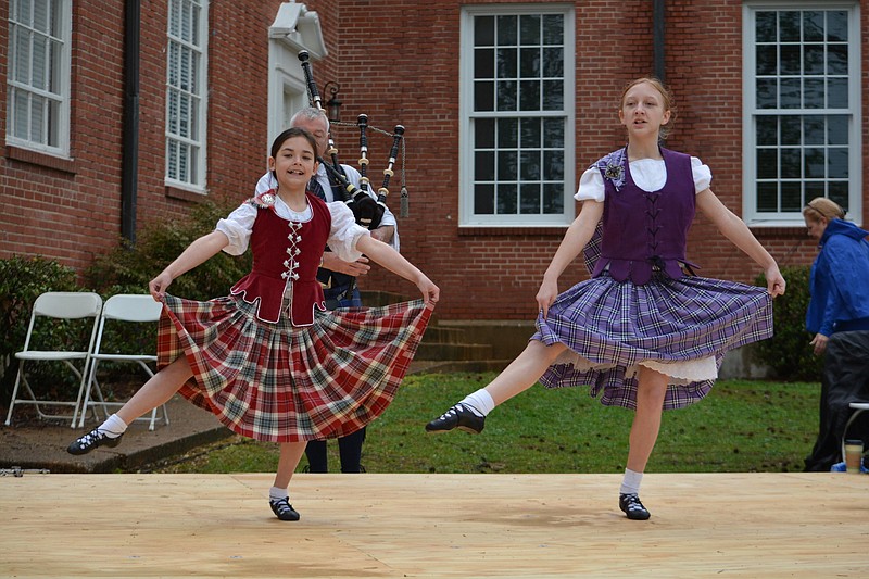 Two girls are shown demonstrating Scottish dances in this 2018 photo. This weekend is the Arkansas Scottish Festival at Batesville’s Lyon College. Expect bagpipes, food, clans and football. (Democrat-Gazette file photo)