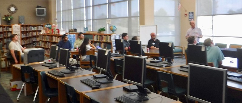 Westside Eagle Observer/SUSAN HOLLAND
Students at Gravette High School listen as Steve Harari, president of the Greater Gravette Chamber of Commerce, gives an introductory slide presentation at a Chamber-sponsored Gravitate event Wednesday, Oct. 5, in the school library. The event, which featured a panel of area business persons, was designed to aid students in making decisions about their future career paths.