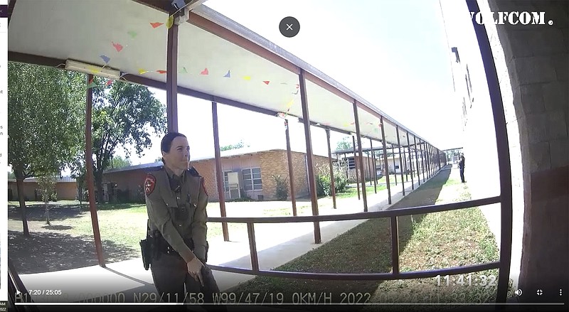 This image from video released by the City of Uvalde, Texas shows Texas Department of Public Safety trooper Crimson Elizondo responding to a shooting at Robb Elementary School, on May 24, 2022 in Uvalde, Texas.  The former Texas state trooper under investigation for the law enforcement response to the deadly school shooting in Uvalde has been hired by the school district as a campus police officer. (City of Uvalde via AP)