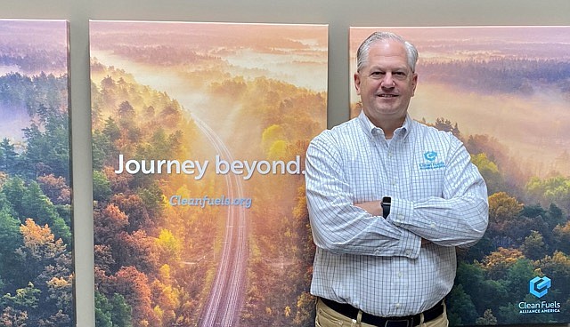 Cameron Gerber/News Tribune photo: 
Donnell Rehagen, chief executive officer of Clean Fuels Alliance America, stands beside branding material for his organization.