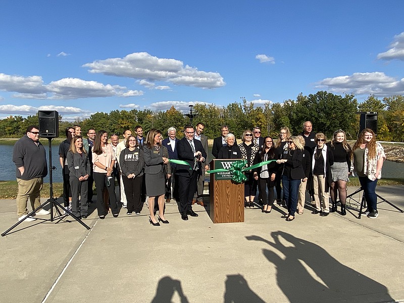 Anakin Bush/Fulton Sun
William Woods University President Jeremy Moreland cuts the ribbon to officially open the new walking trail. Moreland announced the trail's official name is Screech Trail, named after the university's owl mascot.