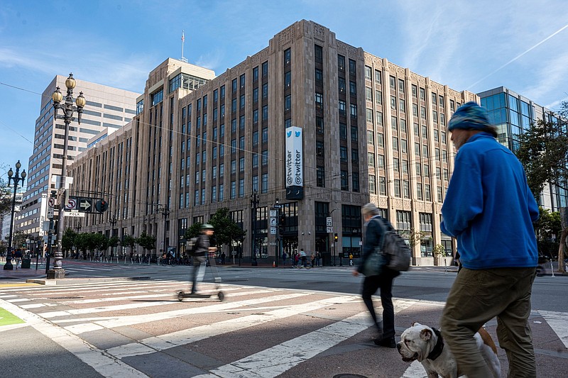 Pedestrians outside Twitter headquarters in San Francisco on Oct. 6, 2022. Stock markets are still not entirely sold on Elon Musk's $44 billion takeover of Twitter Inc. after the billionaire revived the deal at its original price earlier this week. MUST CREDIT: Bloomberg photo by David Paul Morris