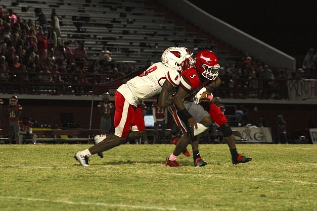 Photo By: Michael Hanich
Camden Fairview defensive back Jabauree Lockhart makes a tackle in the backfield in the game against Magnolia.