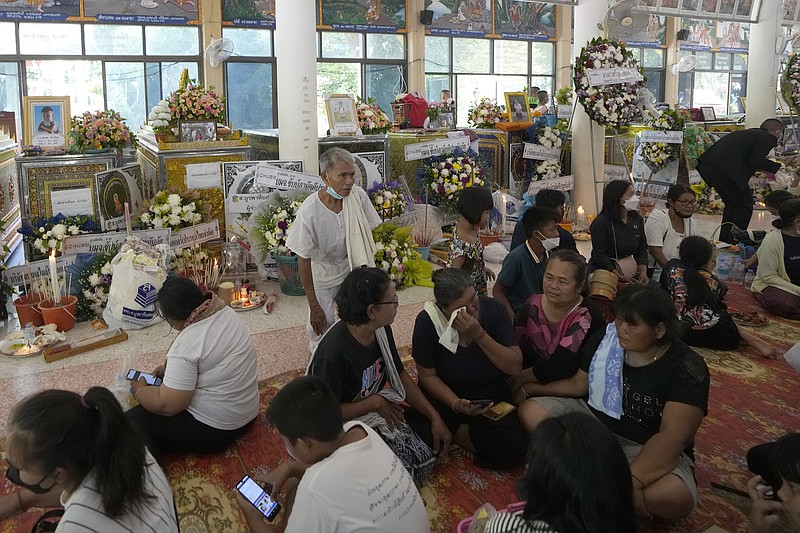 Grief-stricken families pray at Thai temple filled by children’s ...