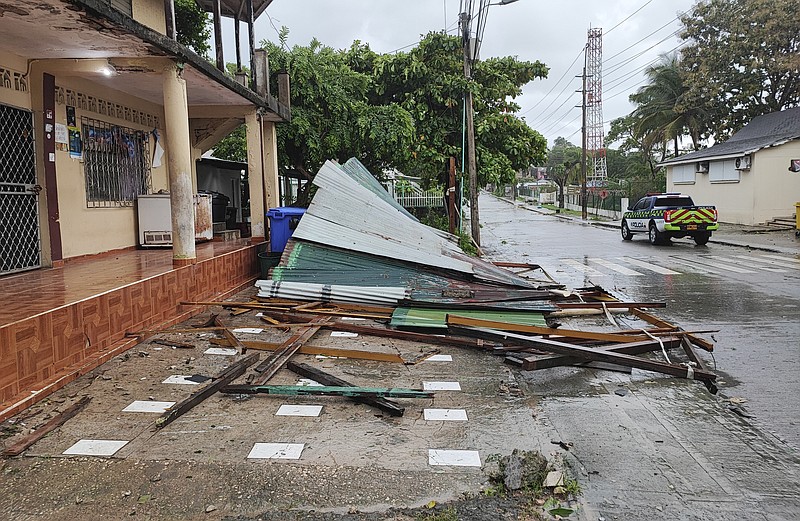 A police car drives by debris thrown in the aftermath of Hurricane Julia in San Andres island, Colombia, Sunday, Oct.9, 2022. Hurricane Julia hit Nicaragua’s central Caribbean coast on Sunday after lashing Colombia’s San Andres island, and a weakened storm was expected to emerge over the Pacific. (AP Photo/Daniel Parra)