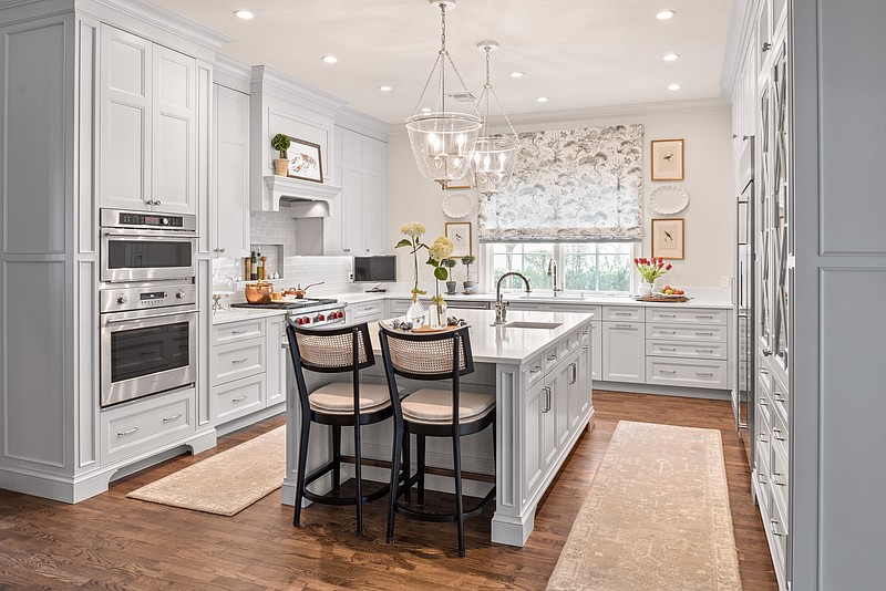 When remodeling this kitchen, the owner chose engineered quartz, which comes in a wide assortment of colors and patterns, for her counters. “I never thought I would buy quartz,” she said, “but I couldn’t find a quartzite that was white enough.” (Courtesy of Skolfield Homes)