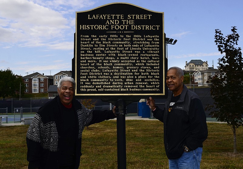 Eileen Wisniowicz/News Tribune photo: 
Glover and Arthur Brown pose next to the Historic Foot District plaque on Friday, Oct. 7, 2022 in Jefferson City.