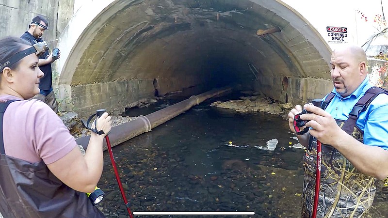 From left, Hot Springs Stormwater Management inspector Robert Ditty, coordinator Rachel Keeling, and manager Aaron Graulau, prepare to enter the Hot Springs Creek tunnel as Zane Colvin stands behind his GoPro camera. - Submitted photo