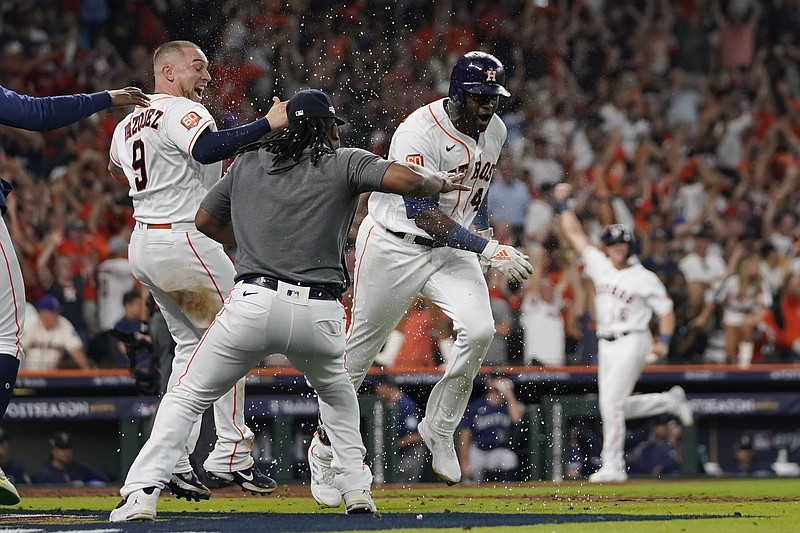 Houston Astros designated hitter Yordan Alvarez (44) celebrates with teammates after his three-run, walkout home run against the Seattle Mariners during the ninth inning in Game 1 of an American League Division Series baseball game in Houston,Tuesday, Oct. 11, 2022. (AP Photo/David J. Phillip)