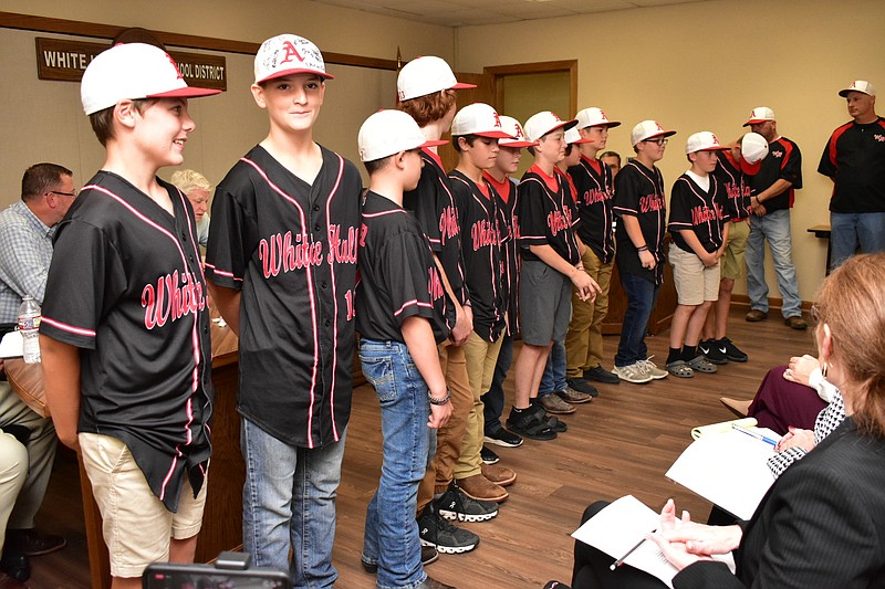 Members of the White Hall 12-year-old Little League All-Star baseball team were honored during the White Hall School Board meeting Tuesday. (Pine Bluff Commercial/I.C. Murrell)