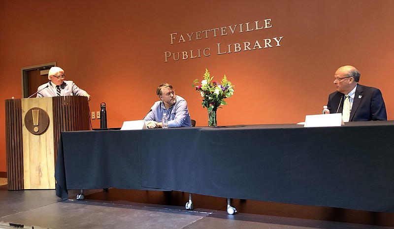 Sloan Scroggin (center), Fayetteville City Council member for Ward 3, and Scott Berna (right), candidate for Ward 3, debate Thursday at the Fayetteville Public Library with forum moderator Steve Clark (left), president of the Fayetteville Chamber of Commerce. Candidates answered questions for an hour at the forum that also was streamed online.
(NWA Democrat-Gazette/Stacy Ryburn)