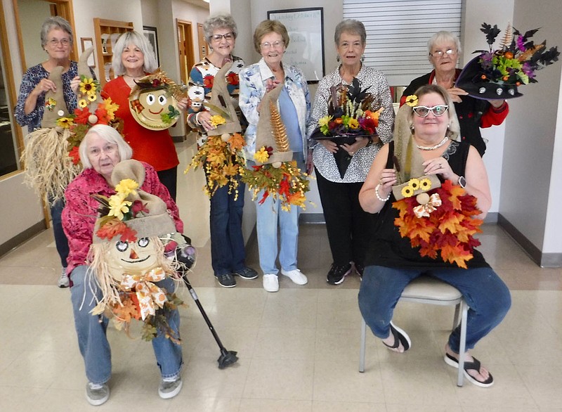 Westside Eagle Observer/SUSAN HOLLAND Participants in a fall craft class at the Billy V. Hall Senior Activity Center display various wall and door hangings they created Tuesday morning, Oct. 11. Pictured are Sandy Steinhaus and Michelinda Smith (seated) and Connie Lashley (back row), Carole Robel, Jeanie Easley, Juanita Whiteside, Fran Croxdale and Penny Leonard. A watercolor class is offered at the Center on the second and fourth Thursday of each month at 10 a.m.