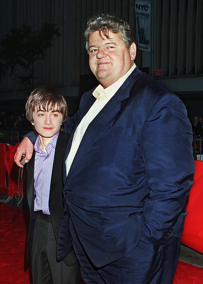 Daniel Radcliffe, left, who plays Harry Potter in the new movie "Harry Potter and the Sorcerer's Stone," and Robbie Coltrane, who plays Hagrid in the film, arrive for the film's New York premiere on Nov. 11, 2001. Coltrane, who played a forensic psychologist on TV series “Cracker” and Hagrid in the “Harry Potter” movies, has died. Coltrane’s agent Belinda Wright said he died Friday at a hospital in Scotland. He was 72. (AP Photo/Darla Khazei, File)