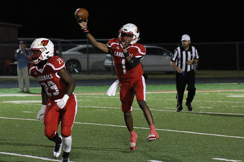 Photo By: Michael Hanich
Camden Fairview quarterback Martavius Thomas passing the ball down the field in the game against De Queen.