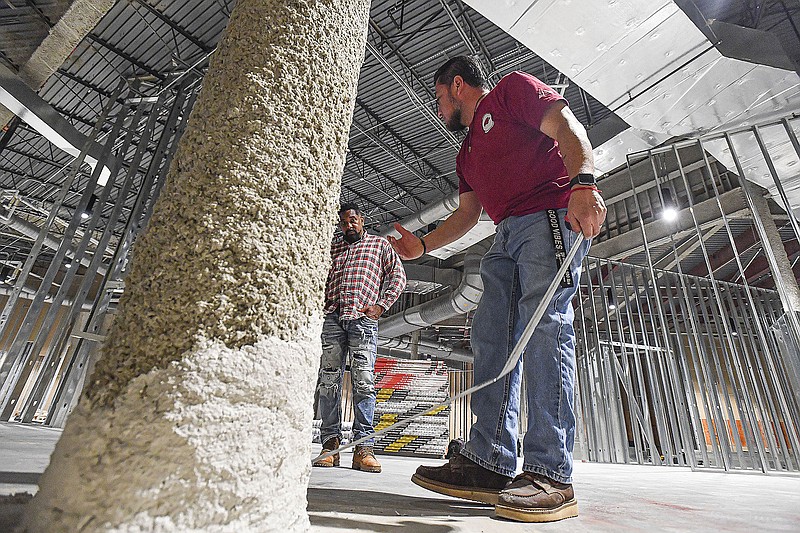 Ahmad Trench (from left), Carlos Nabarro and other workers with SMP Contractors work, Thursday, Oct. 13, 2022, while building out space for future exhibits at the U.S. Marshals Museum in Fort Smith. Ben Johnson, president and chief executive officer of the museum, said he expected the facility will be open to the public sometime in the summer. Visit nwaonline.com/221016Daily/ for today's photo gallery.
(NWA Democrat-Gazette/Hank Layton)