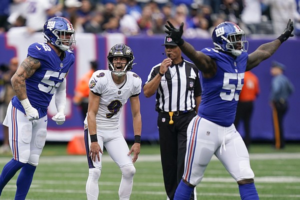 Baltimore Ravens kicker Justin Tucker (9) reacts after kicking a