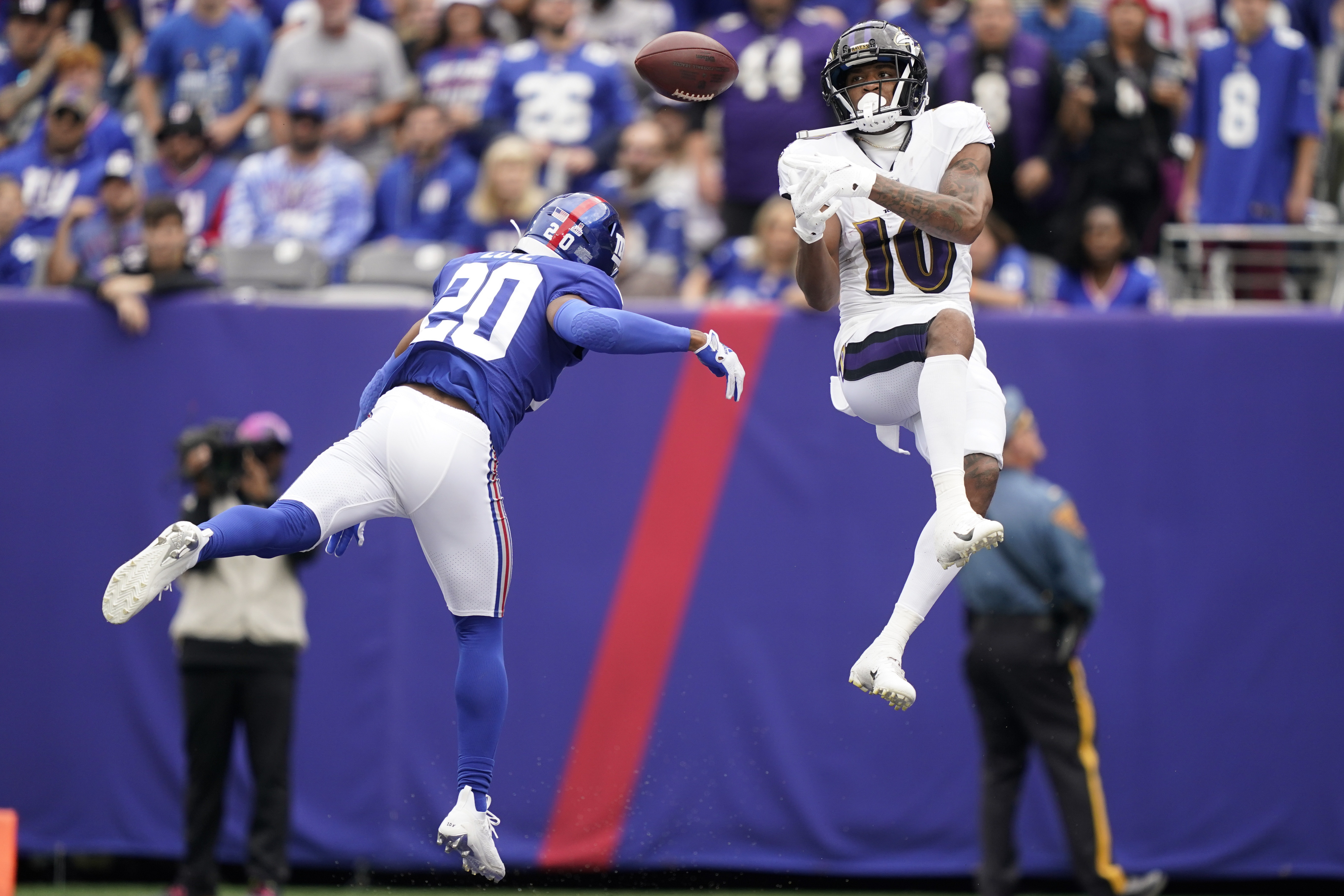 Baltimore Ravens running back J.K. Dobbins (27) runs with the ball against  the New York Giants during an NFL football game Sunday, Oct. 16, 2022, in  East Rutherford, N.J. (AP Photo/Adam Hunger