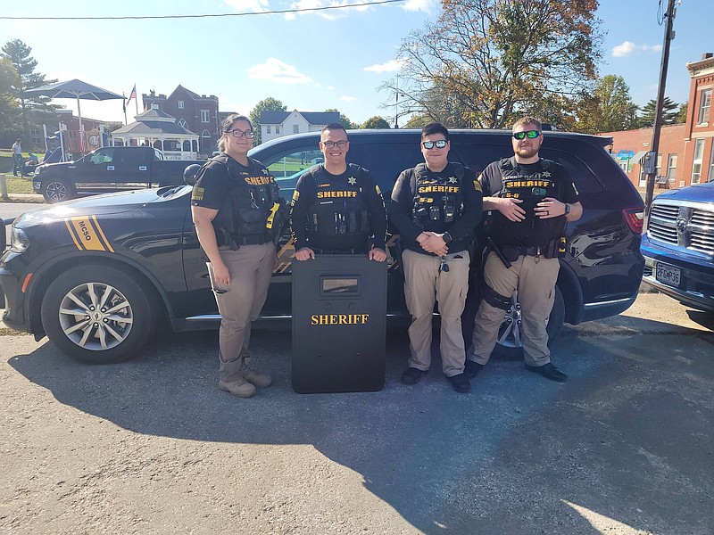 Submitted — Moniteau County Sheriff's Office deputies pose for a photo with their new ballistic shield, which was donated by the United States Deputy Sheriff's Association. The department did not previously have a ballistic shield, which is used in scenarios where officers interact with barricaded or armed subjects.