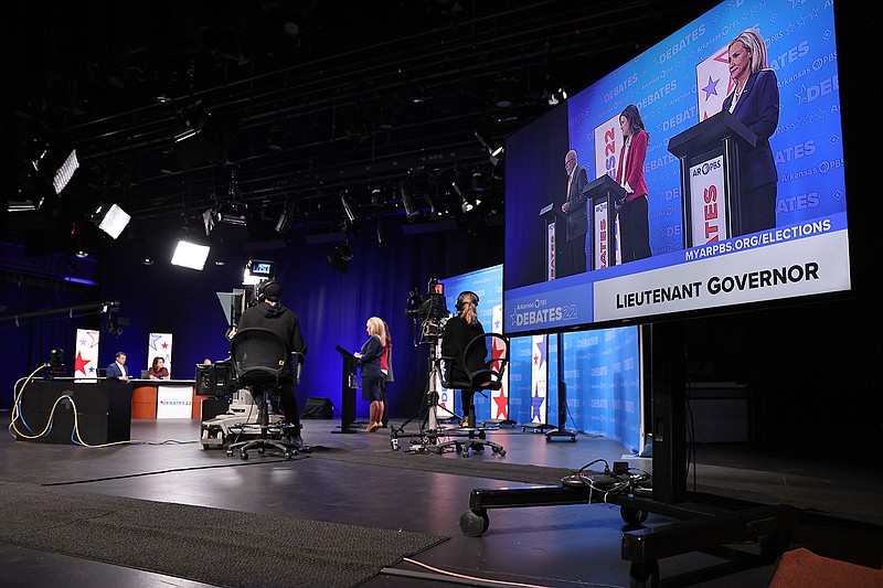 Candidates for Arkansas Lt. Governor, center, take the stage for a debate at the Donald W. Reynolds Performance Hall on the University of Central Arkansas campus Tuesday, Oct. 18, 2022. (Arkansas Democrat-Gazette/Colin Murphey)